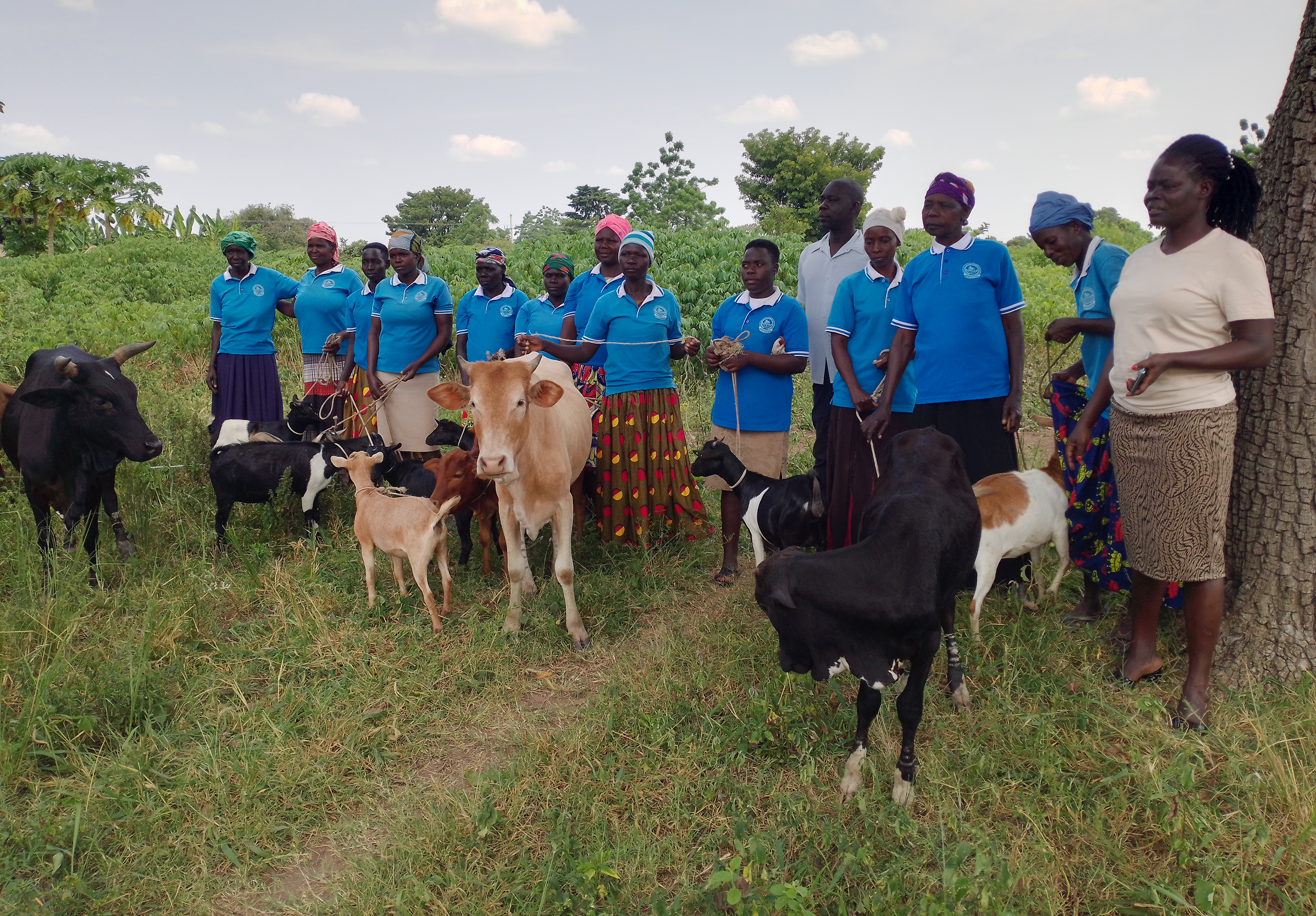 Jessica Apio, the DCDO (right) with Okoona Women and youth savings and credit group members on Monday Jessica Apio, the DCDO (right) with Okoona Women and youth savings and credit group members on Monday
